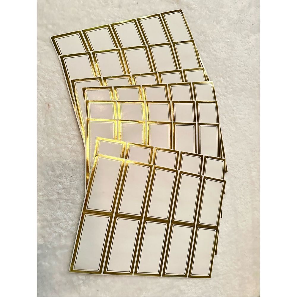 White and gold sticker labels ￼